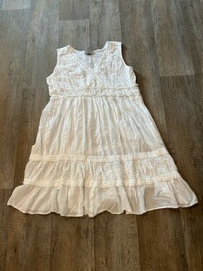 White cotton eyelet dress with ruffles and lace details. Size: 2X